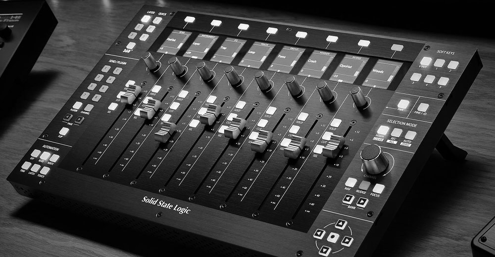 black and white photo of faders on an SSL audio console